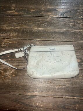 Coach gray Perforated Leather Wristlet with removable strap.